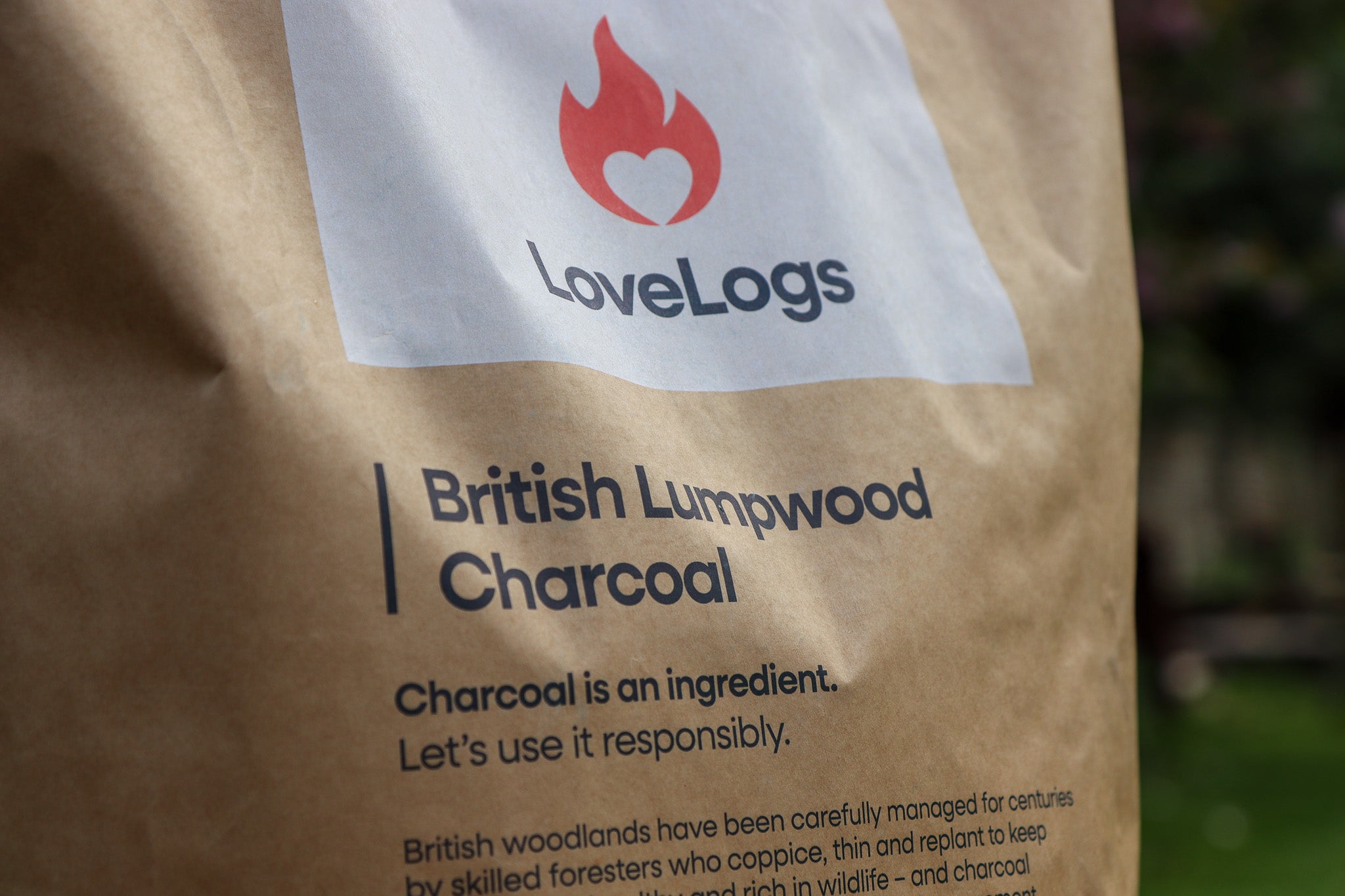 Back of the Love Logs British cherrywood charcoal bag showing product details