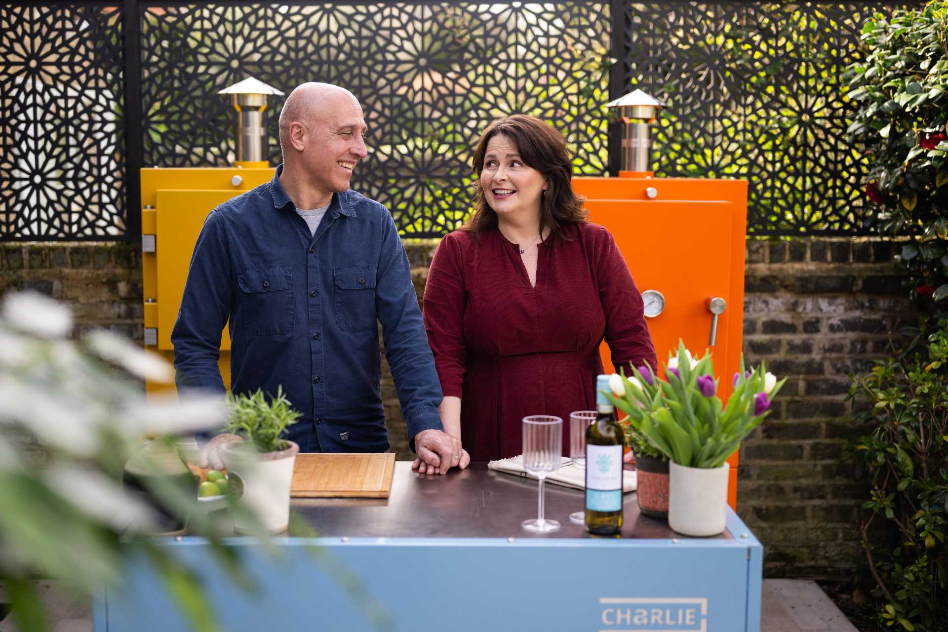 Tara and Neil Outside in a Charlie Oven Outdoor Kitchen