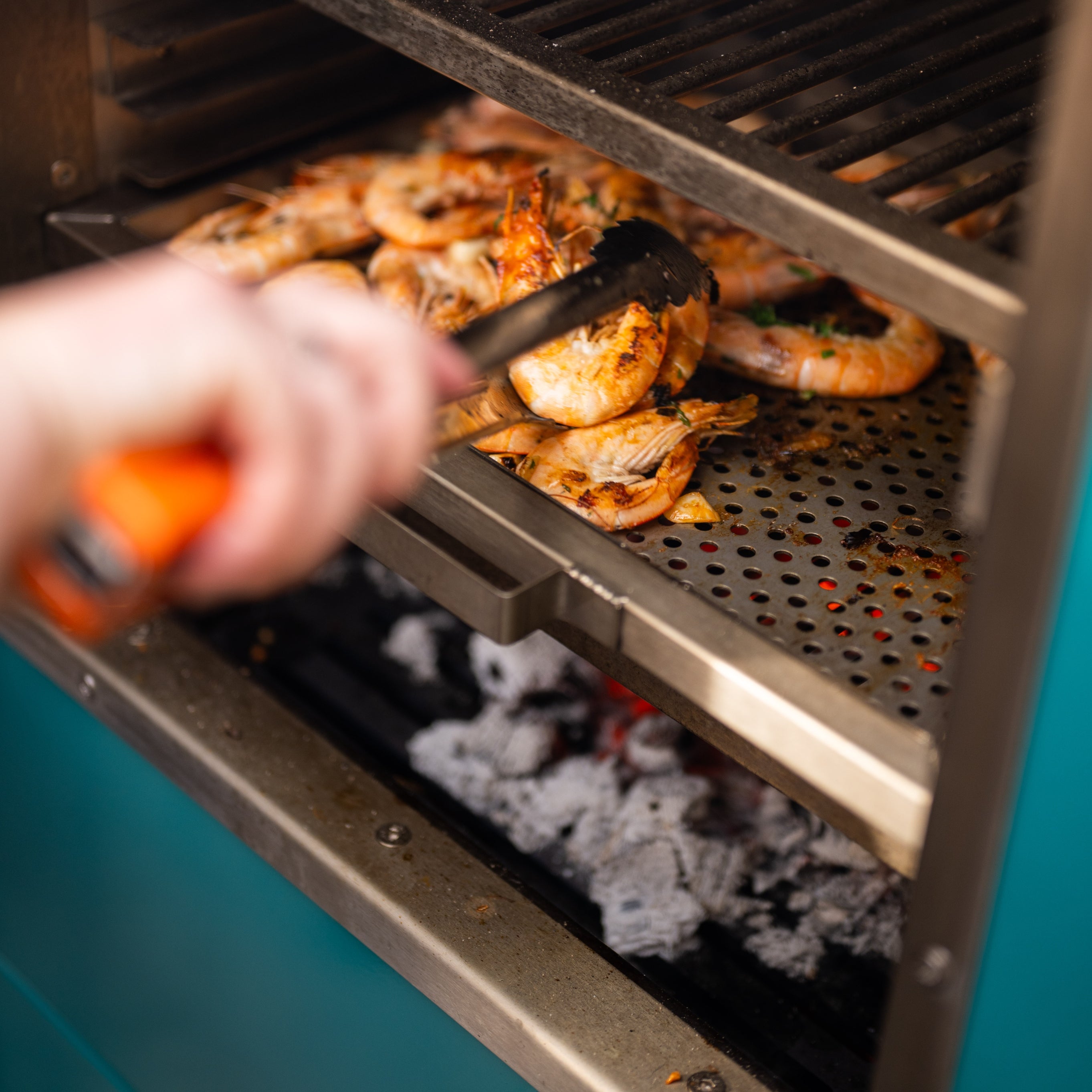 Prawns being grilled in a Charlie Oven