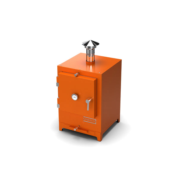 Cheeky Charlie Tabletop Oven in Saffron, a bright vibrant orange, angled view with the door closed