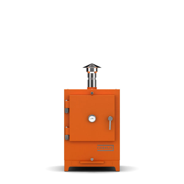 Cheeky Charlie Tabletop Oven in Saffron, a bright vibrant orange, front view with the door closed