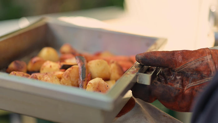 Golden roast potatoes and carrots in the Deep Roasting Tray Rack