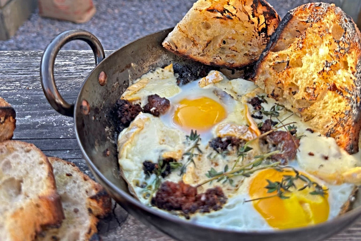Baked eggs with sobrasada, Vacherousse cheese and honey
