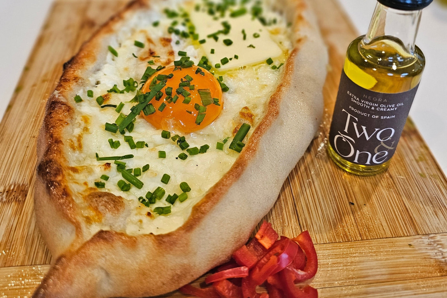 Khachapuri:  A Georgian Cheese Boat of Gooey Perfection A Classic Dish with Rich Cheese, Buttery Toppings, and Fresh Herbs