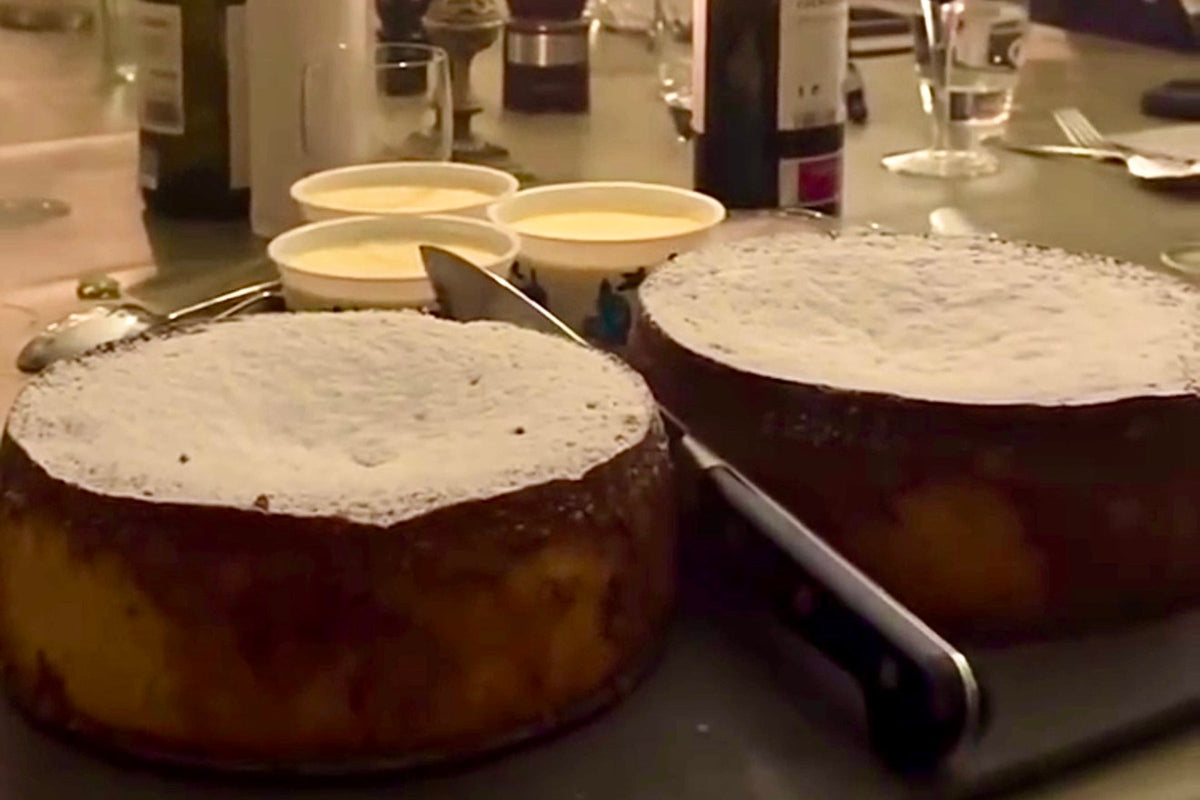orange and almond cake ready to cut served with clotted cream