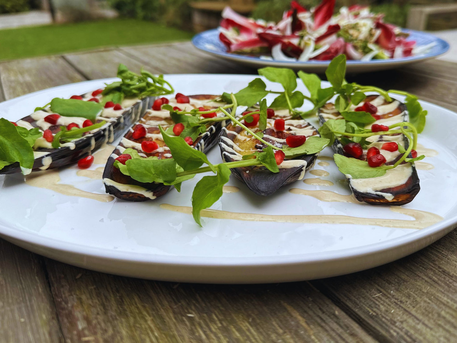 Baked Aubergines with Tahini, Pomegranate, and Watercress by Chef Bart Van Der Lee. - Charlie Oven