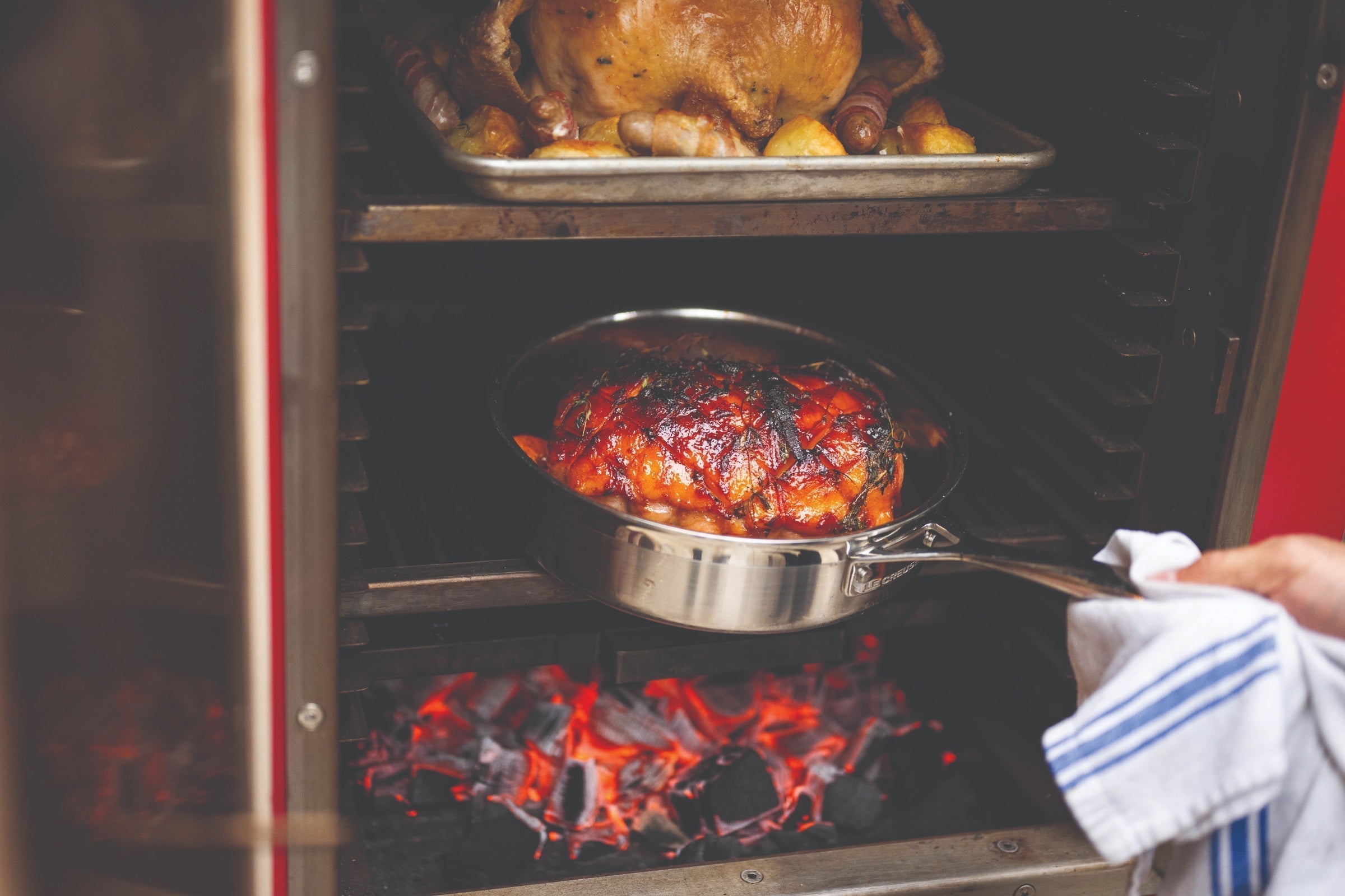Baked ham and turkey cooking in the charlie oven