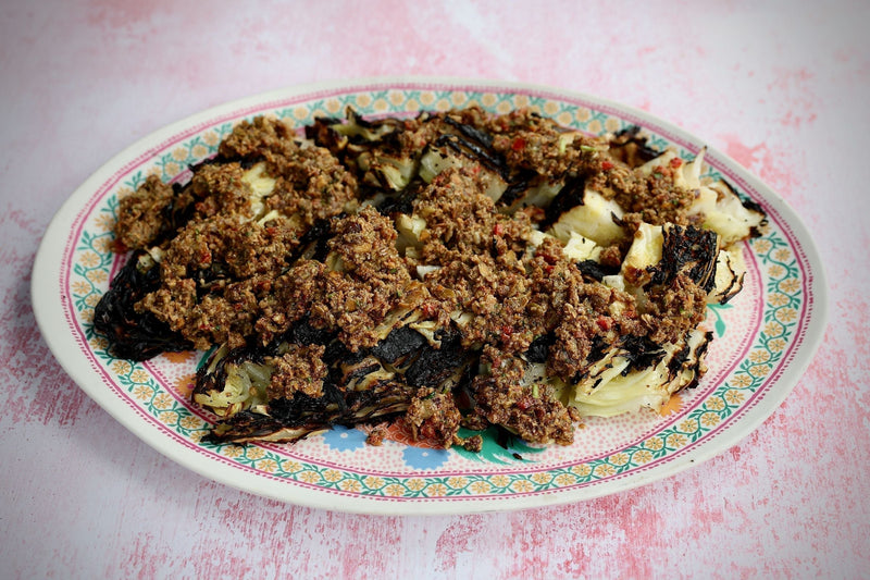 Charred Hispi Cabbage. Pumpkin Seed Pistou by Chef Andrew Clarke.