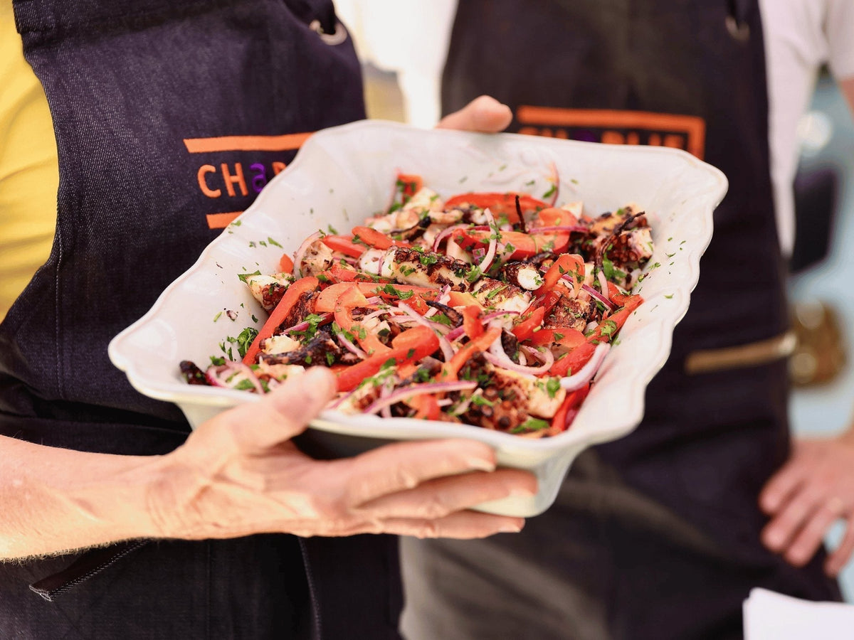 Grilled octopus salad with peppers and onions