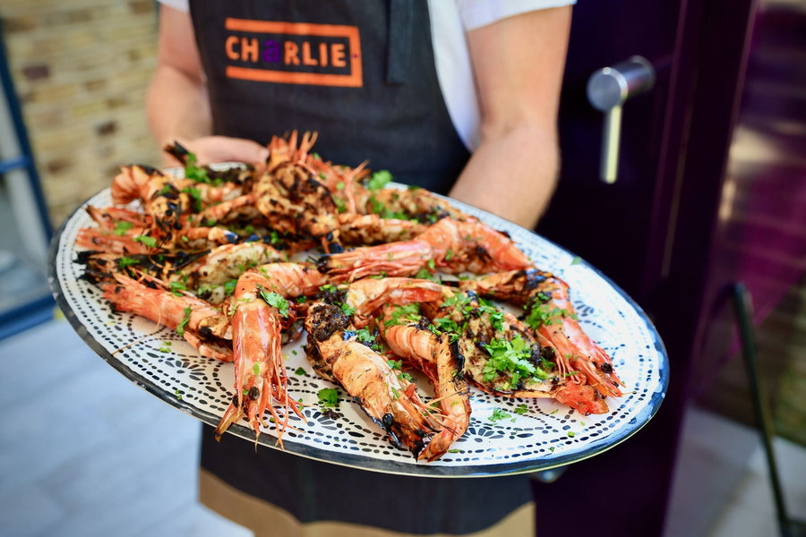 Black Garlic Roasted Jumbo Prawns with Pickled Lemon and Coriander by Chef Bart Van Der Lee. - Charlie Oven