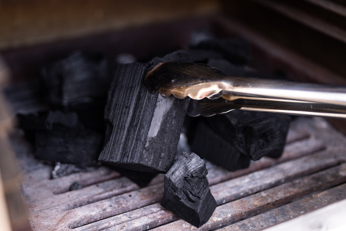 Placing charcoal in the oven