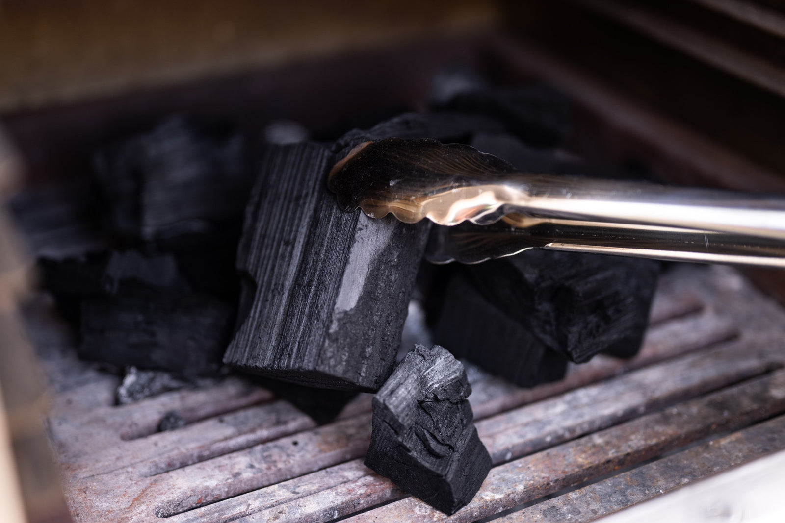 Placing charcoal in the oven
