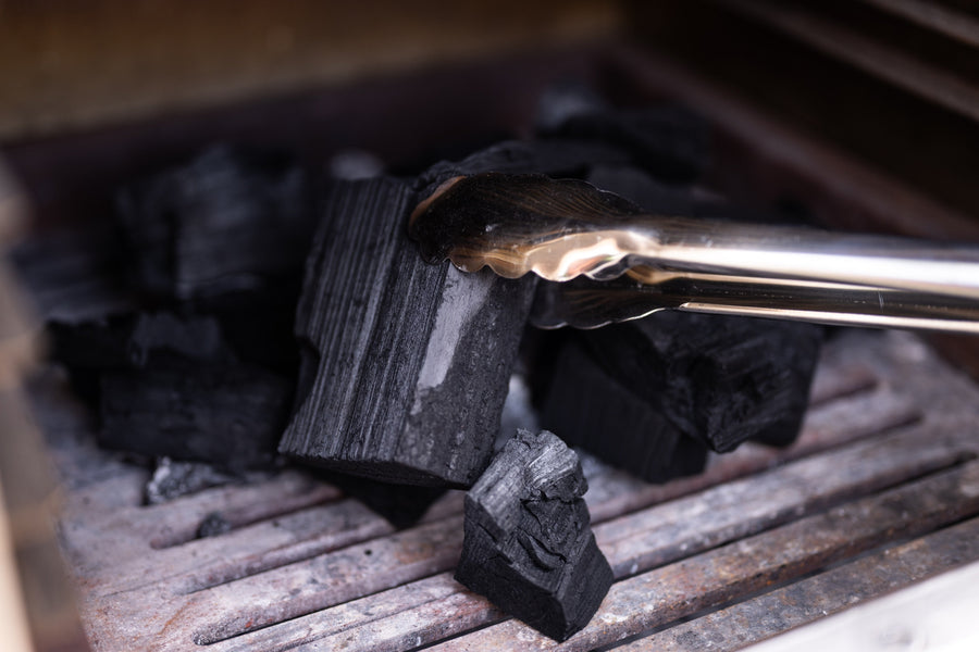 Placing charcoal in the oven