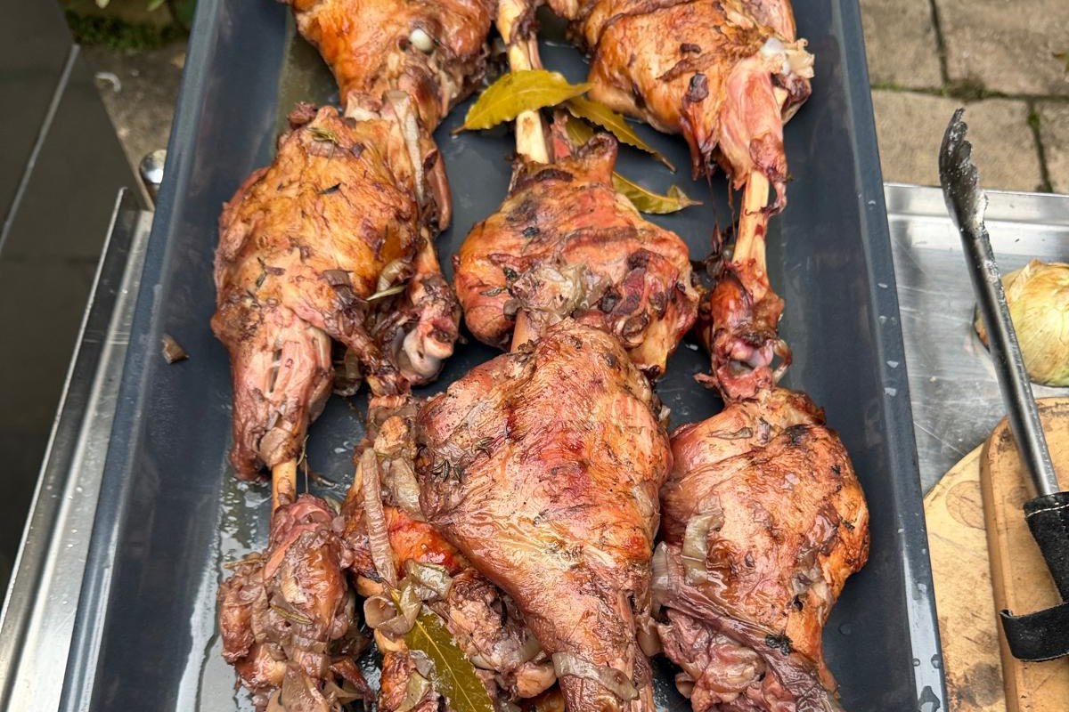 Spanish milk fed lamb legs braised in red wine in the Charlie Oven and served with green lentils and cavolo nero