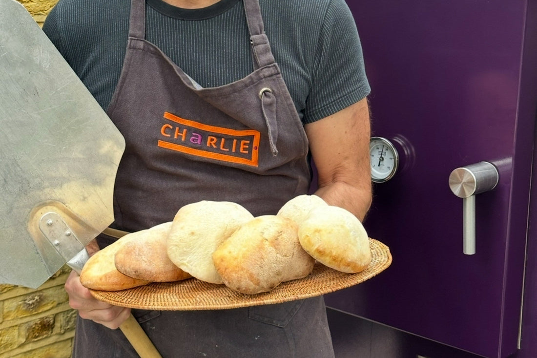 Homemade pitta breads baked over fire