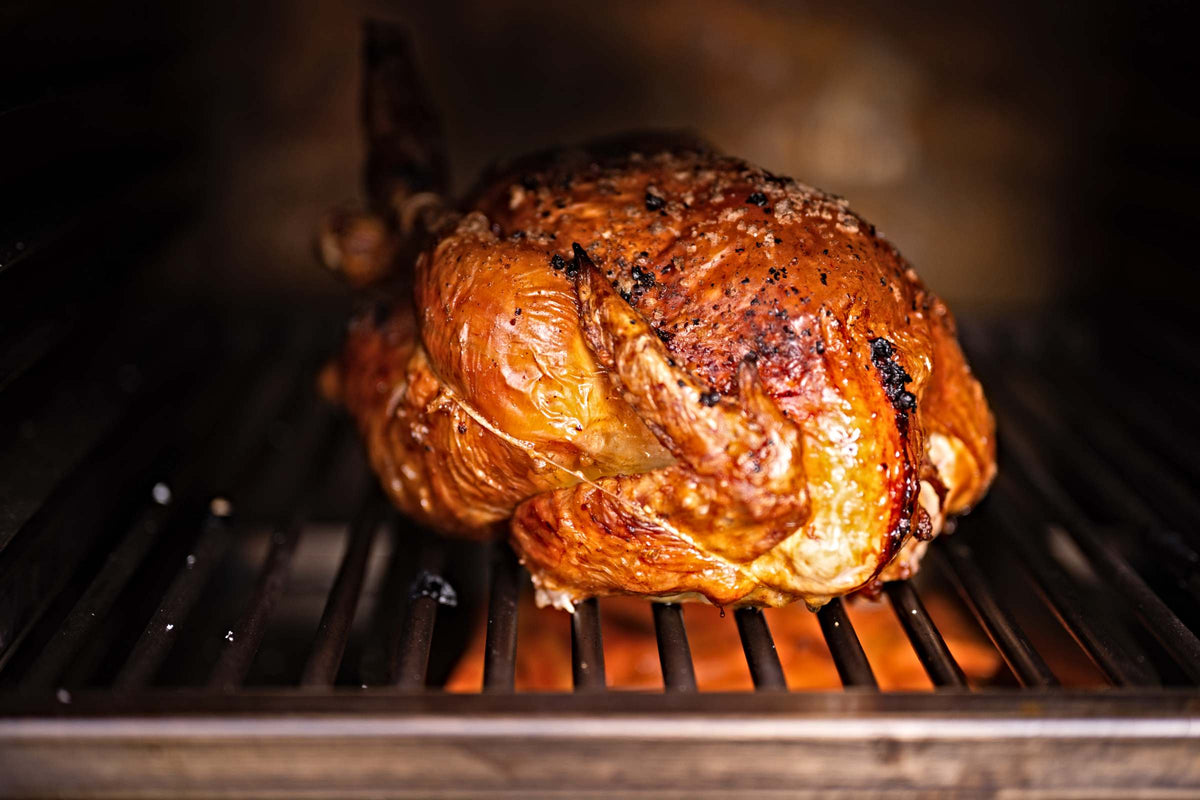 Roast chicken with dauphinoise potatoes and roasted carrots in the Charlie Oven