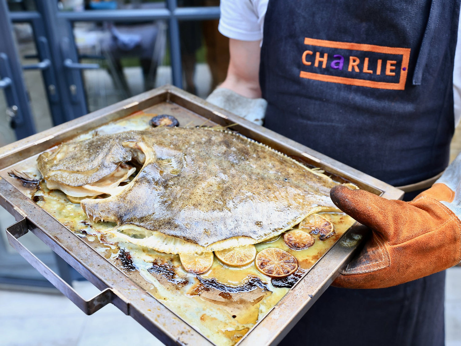 Whole Wood Fired Turbot with Lime, Thyme, And Hazelnut Vinaigrette by Chef Bart Van Der Lee. - Charlie Oven