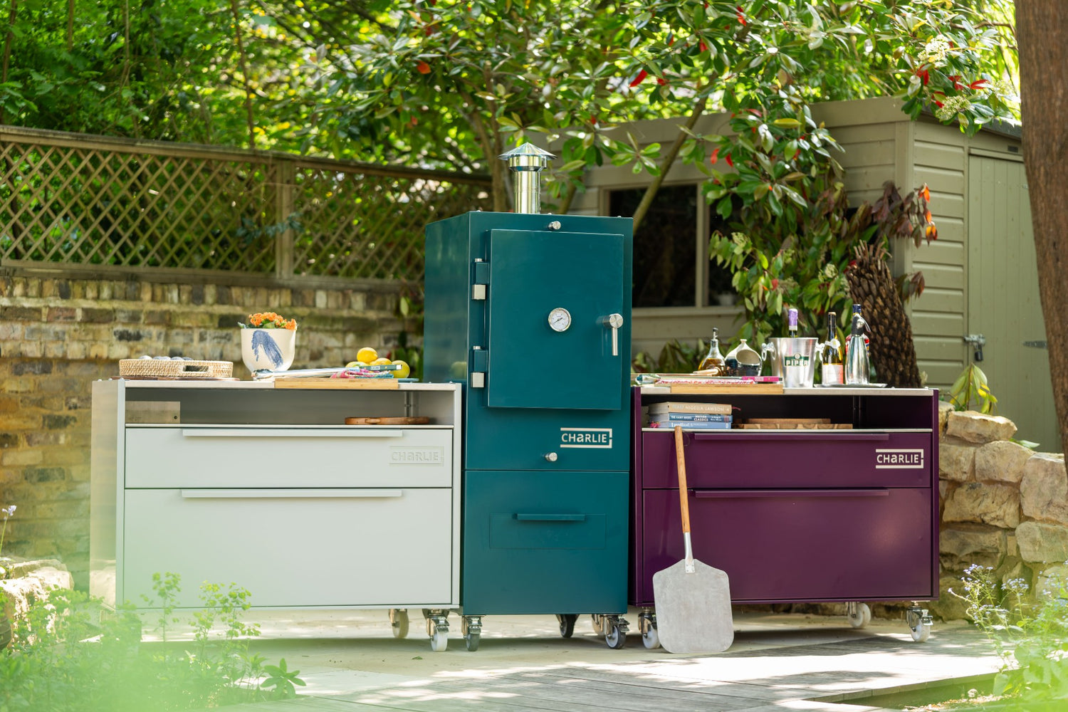 outdoor kitchen with island units

Charlie Oven outdoor kitchen setup

colourful outdoor kitchen UK

freestanding outdoor kitchen cabinets

weatherproof garden kitchen furniture

Beetroot Agave Truffle kitchen colours

charcoal-fired garden oven

modern British outdoor kitchen design

bespoke outdoor kitchen setup