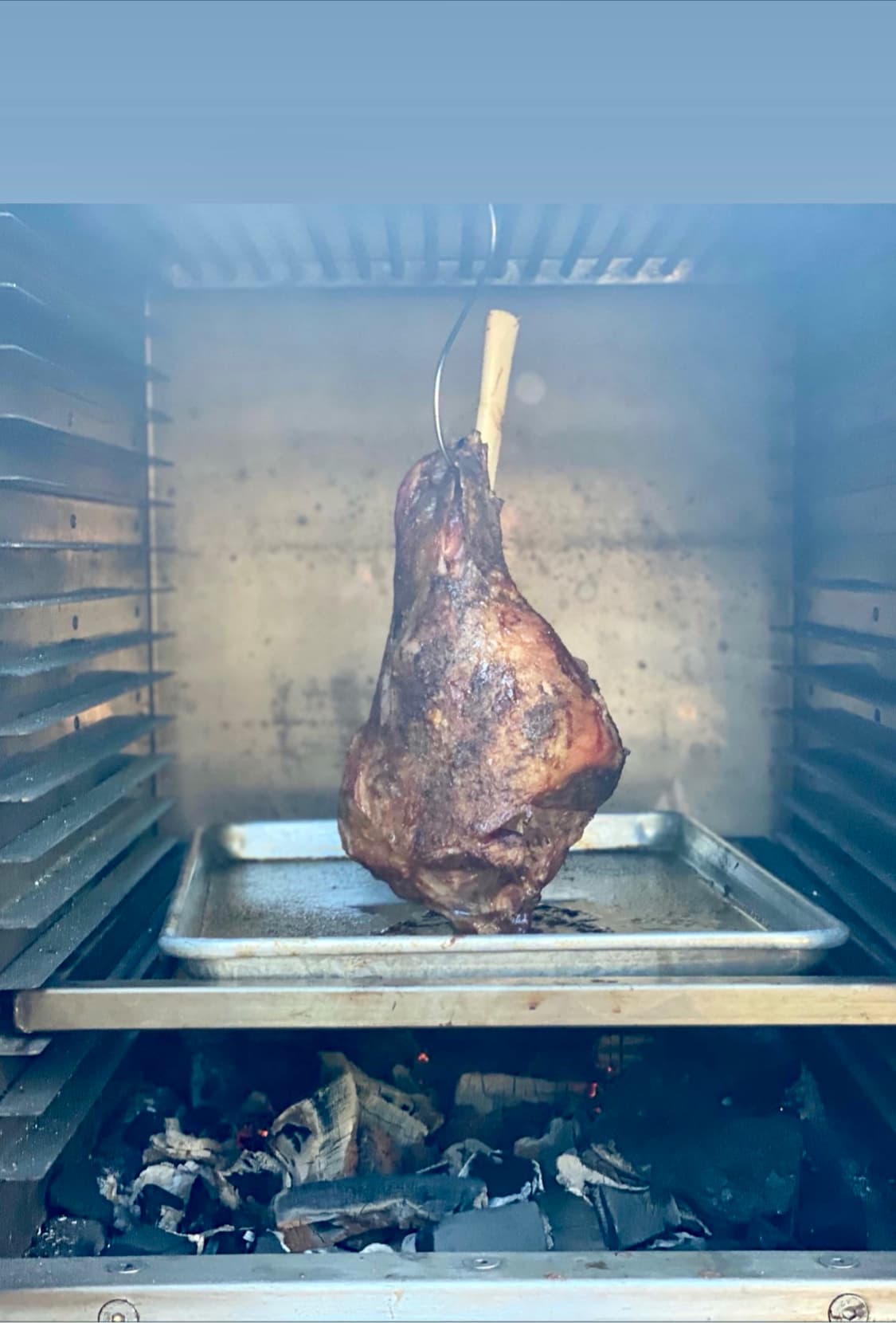Smoked lamb hung inside the  the Charlie Charcoal Oven and cooked for 3 hours at 110 degrees C