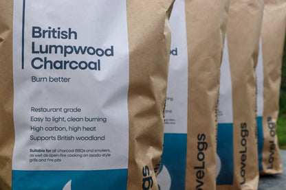 Row of Love Logs British cherrywood charcoal bags ready for the barbecue