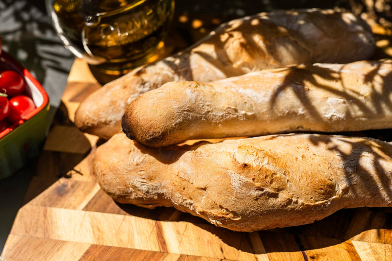 The crisp, open crust of baguettes baked on a hot stone over charcoal