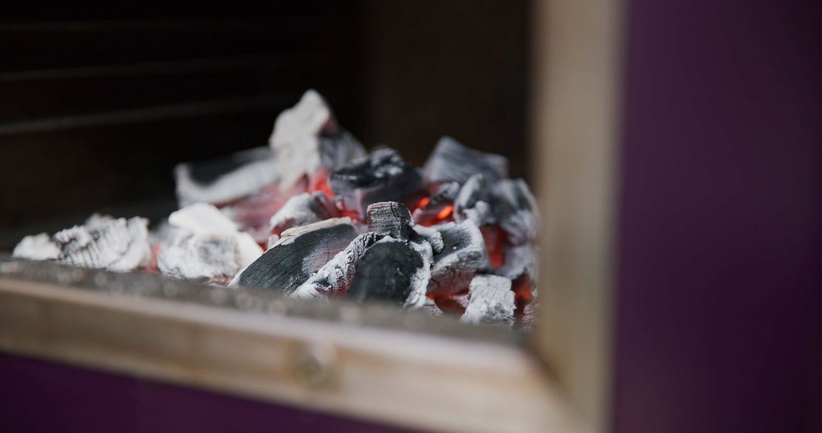 Glowing charcoal inside a Beetroot Charlie oven