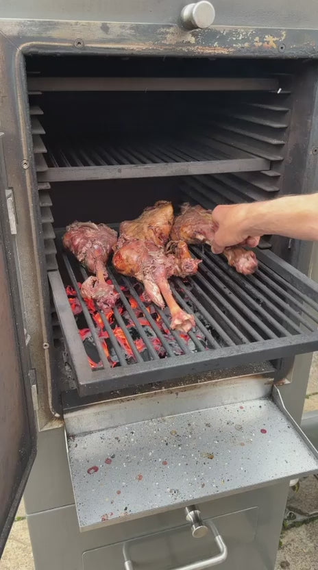 Browning the lamb over the charcoal