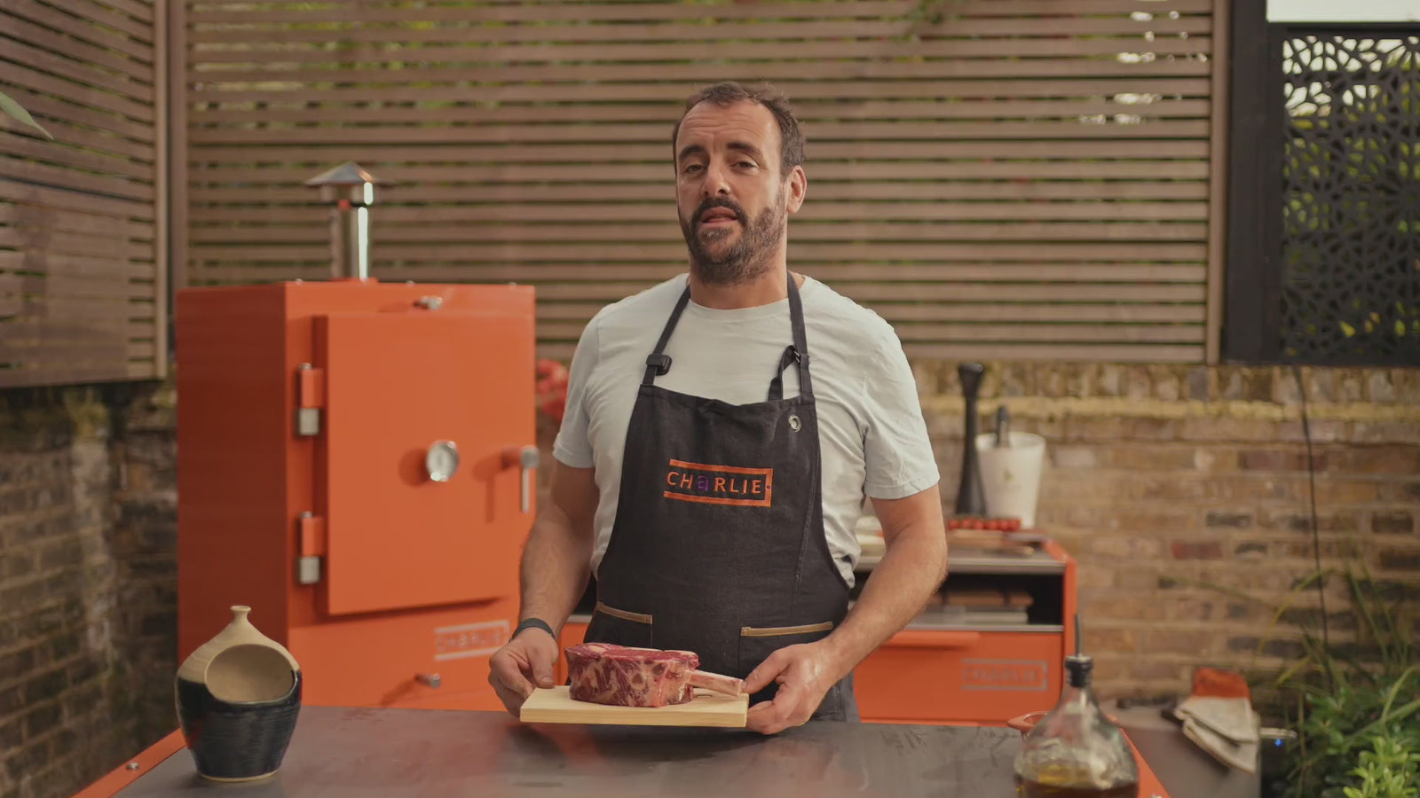 James Wheltor cooks a thick bone-in ribeye on Charlie’s Argentine grill