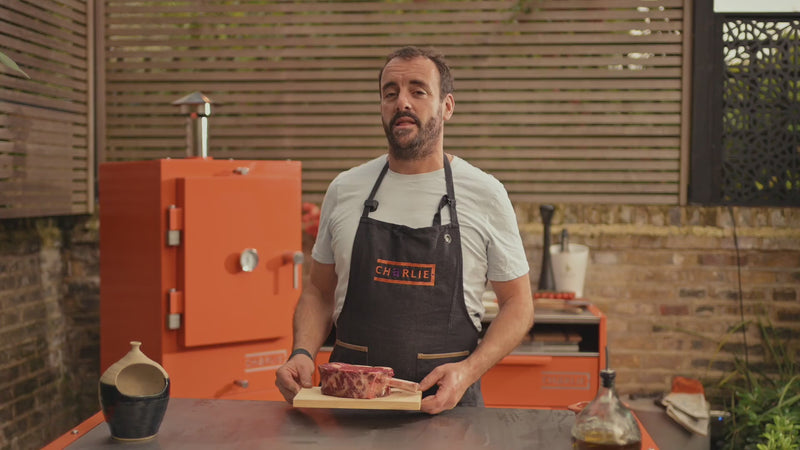 James Wheltor cooks a thick bone-in ribeye on Charlie’s Argentine grill